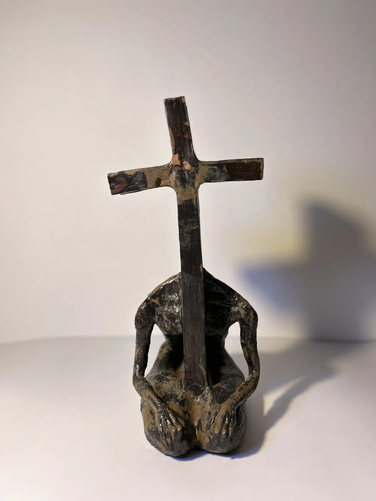 Image of Cross-headed by VITALIY KRASUTSKIY, made of Chamotte clay, ceramic glazes, plaster, acrylic, Sculpture medium, from Lviv, part of the Series 1 series Photo 2 of 8.